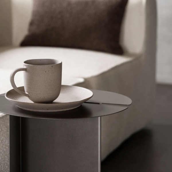 ORU side table by blomus with a coffee cup placed on top.