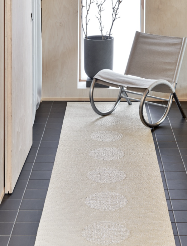 Hallway with Vera 2.0 Pappelina Area Rug in colour Linen and Stone Metallic
