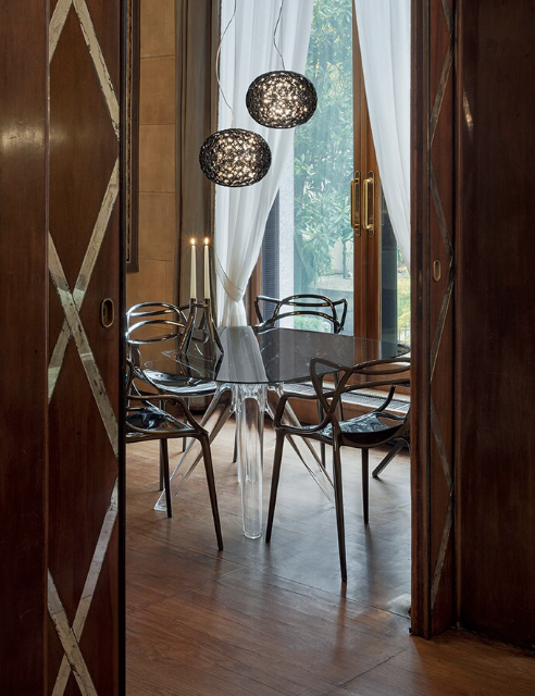 A photo of a window scene with Kartell Masters Metal shown in Titanium