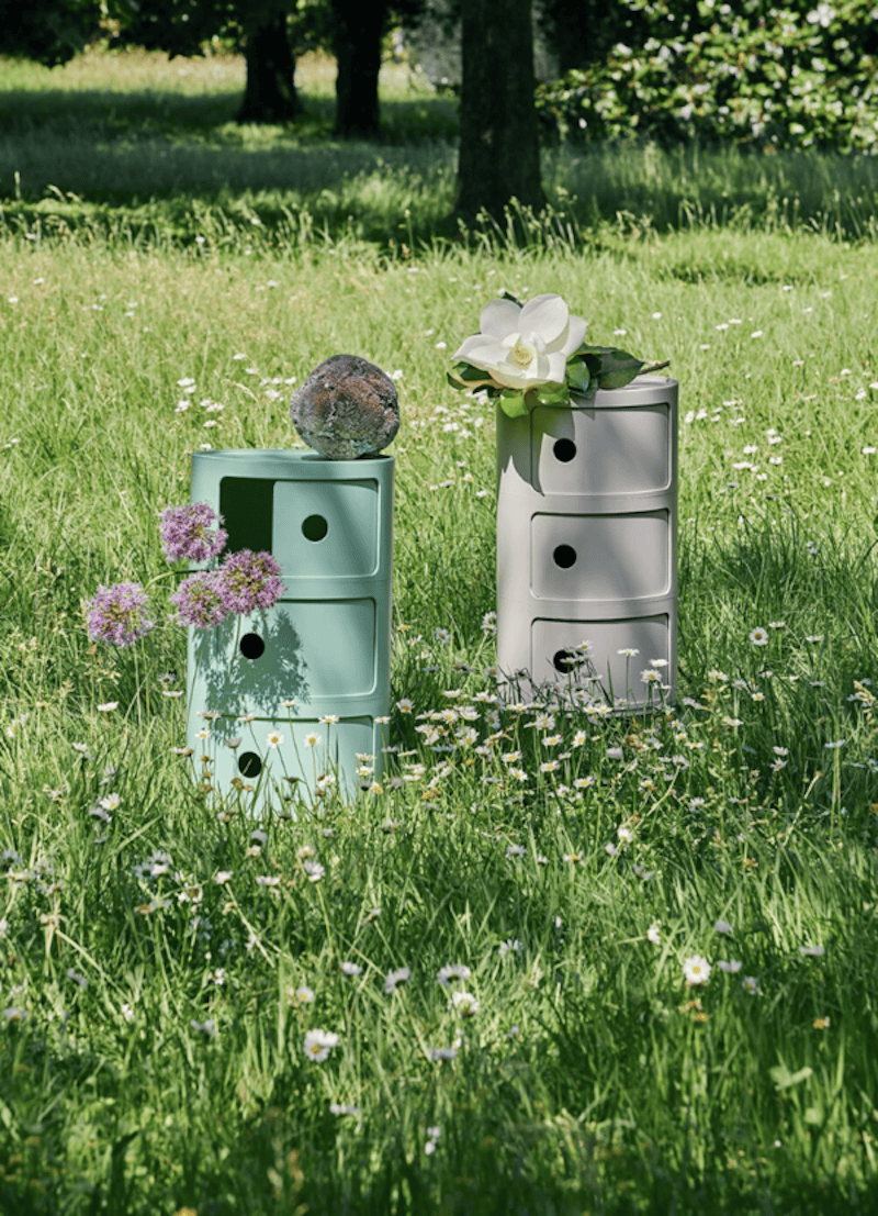 Photo of Kartell BIO Componibili in a meadow in Green and Cream Colours